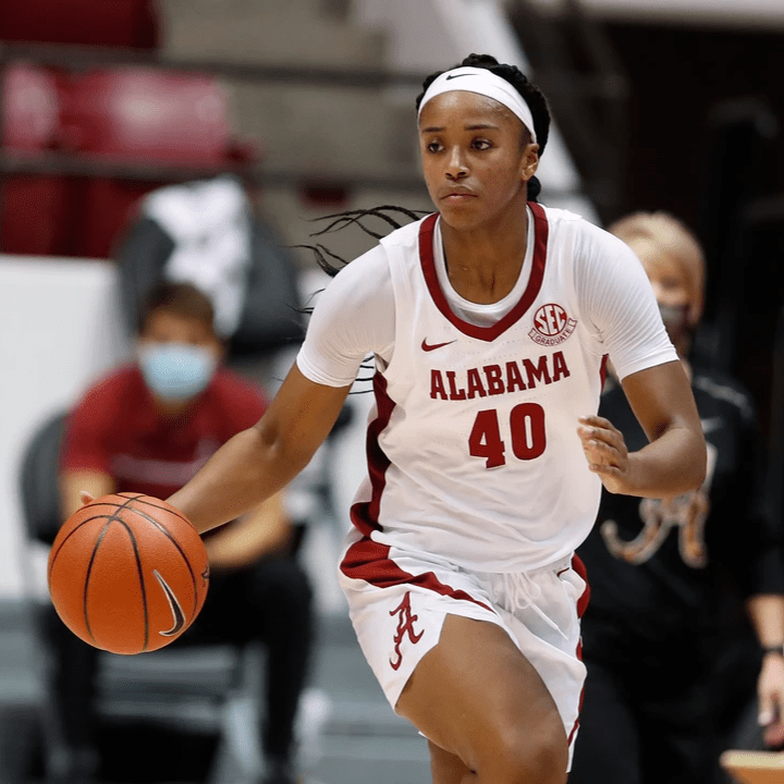 Jasmine dribbles the ball off the court Jasmine dribbles the ball off the court