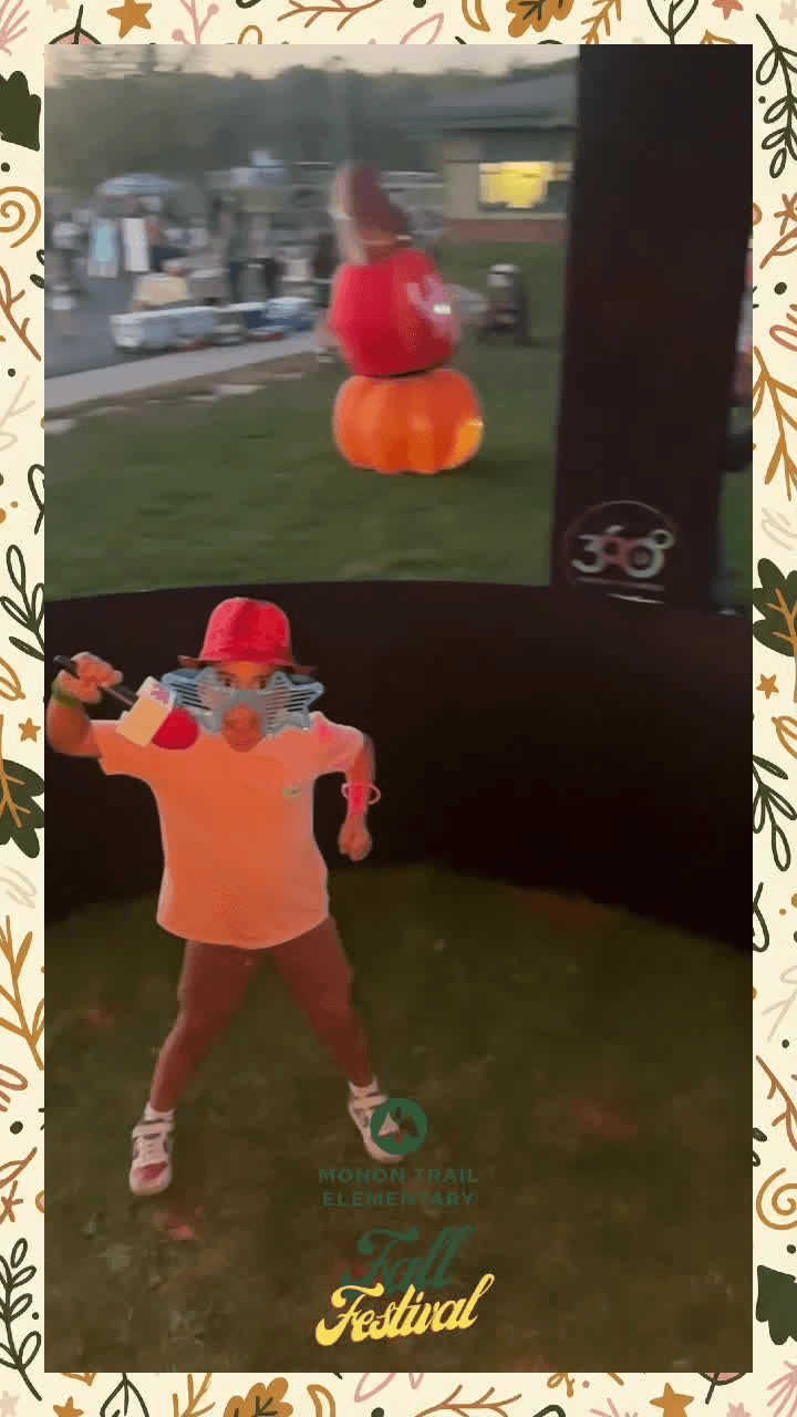 Outdoor 360 video booth on a school lawn at dusk during a fall festival Outdoor 360 video booth on a school lawn at dusk during a fall festival