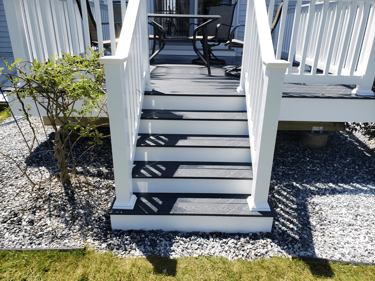 Photo of Trex "Winchester" - picture framed stair treads, PVC rim, risers and stringers Photo of Trex "Winchester" - picture framed stair treads, PVC rim, risers and stringers