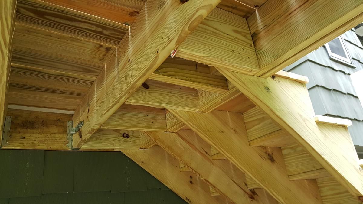 Image of quality deck construction - 2x12 stringers framed to deck Image of quality deck construction - 2x12 stringers framed to deck