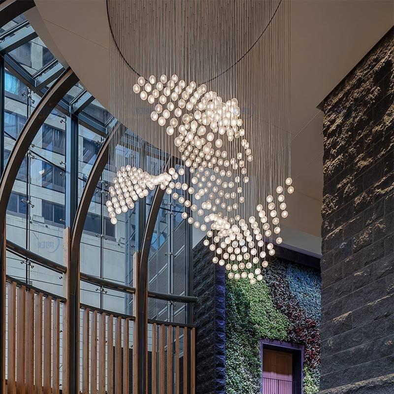 Modern amber glass globe pendant chandelier for mid-height hotel lobbies Modern amber glass globe pendant chandelier for mid-height hotel lobbies