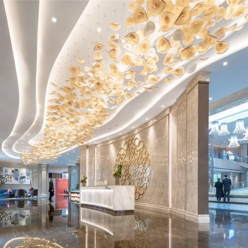 Custom lotus-inspired glass chandelier for wellness hotel lobby lighting Custom lotus-inspired glass chandelier for wellness hotel lobby lighting
