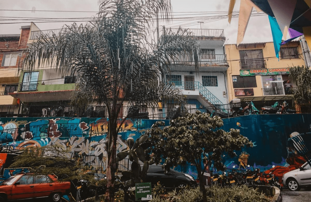 street art and red car and apartments in comuna 13 Commune 13 San Javier in medellin  street art and red car and apartments in comuna 13 Commune 13 San Javier in medellin