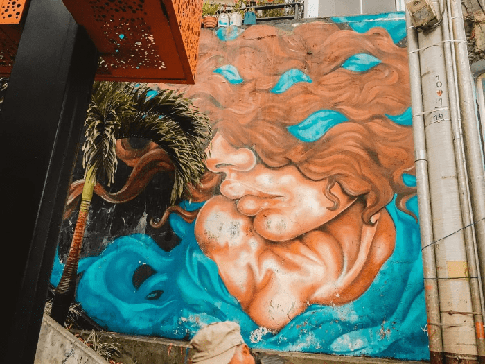 Street art woman with baby and brown wavy hair at comuna 13 Commune 13 San Javier Street art woman with baby and brown wavy hair at comuna 13 Commune 13 San Javier