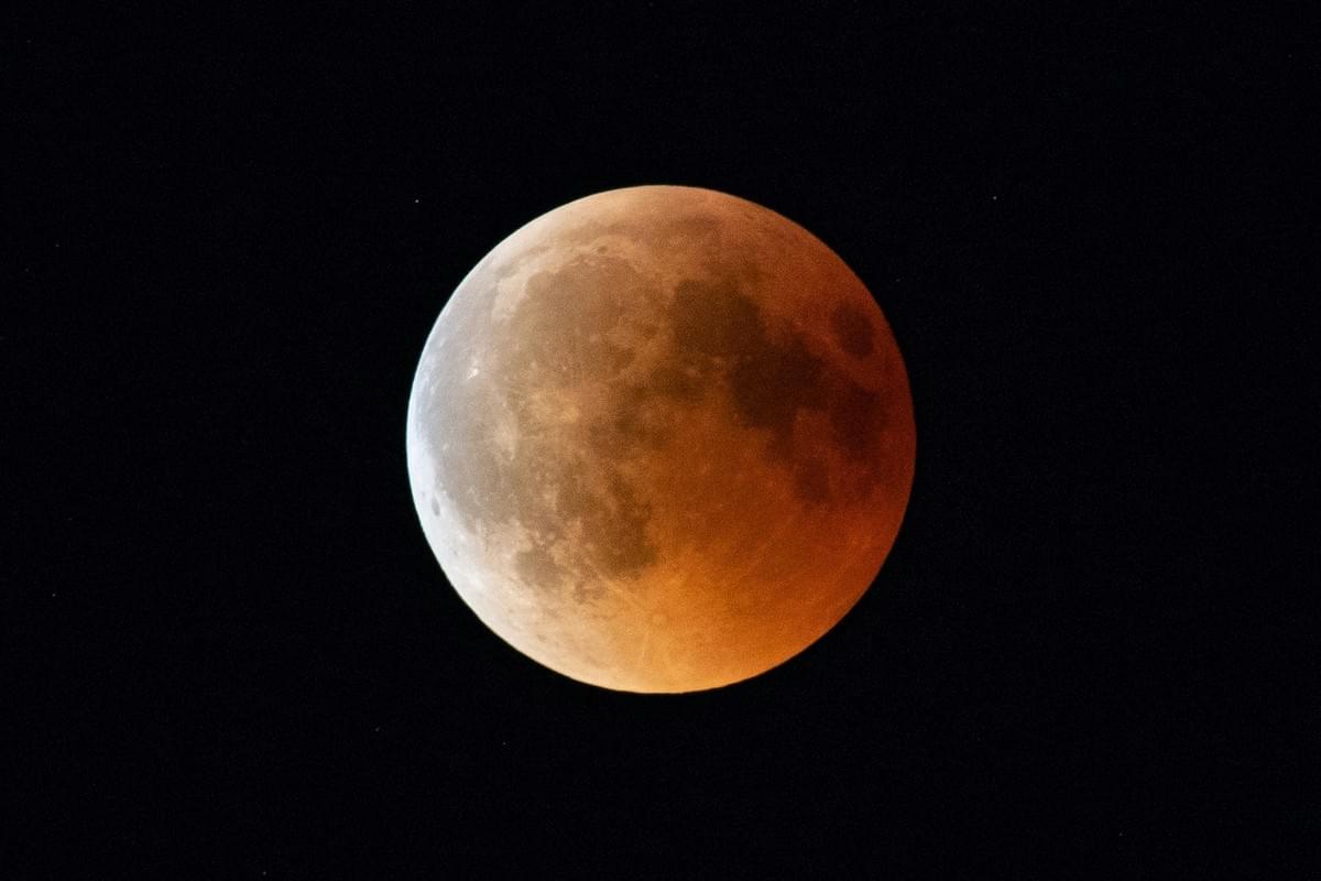 full moon aglow on dark background full moon aglow on dark background