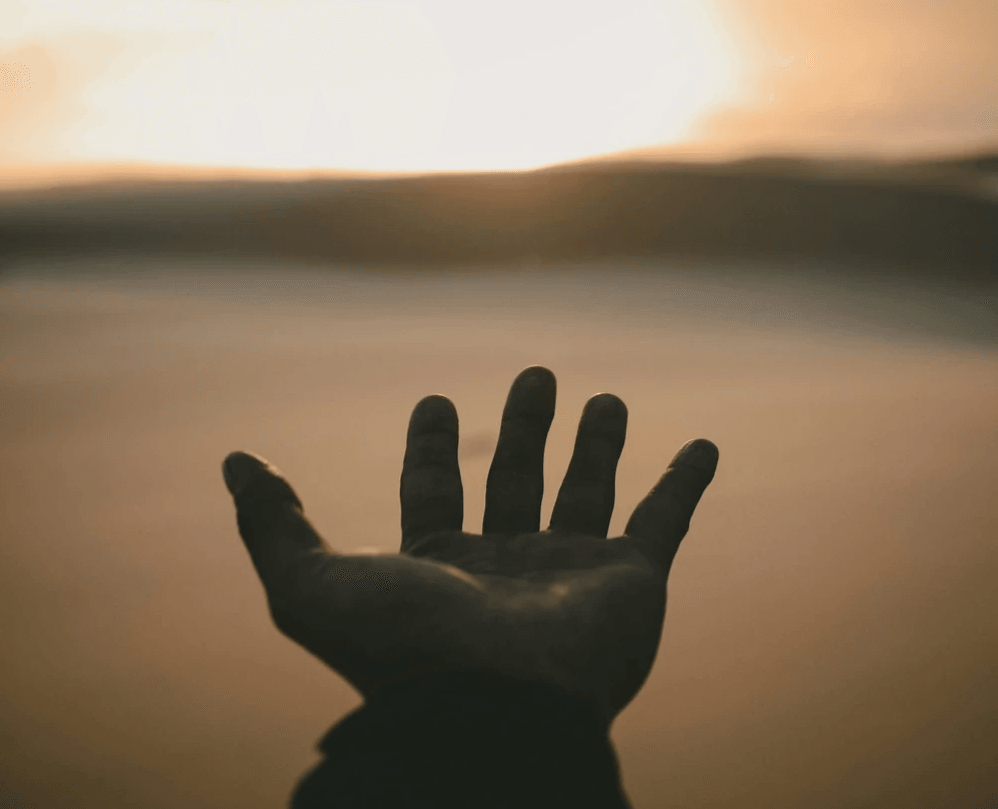 shadowed hand reaching out into the mists shadowed hand reaching out into the mists