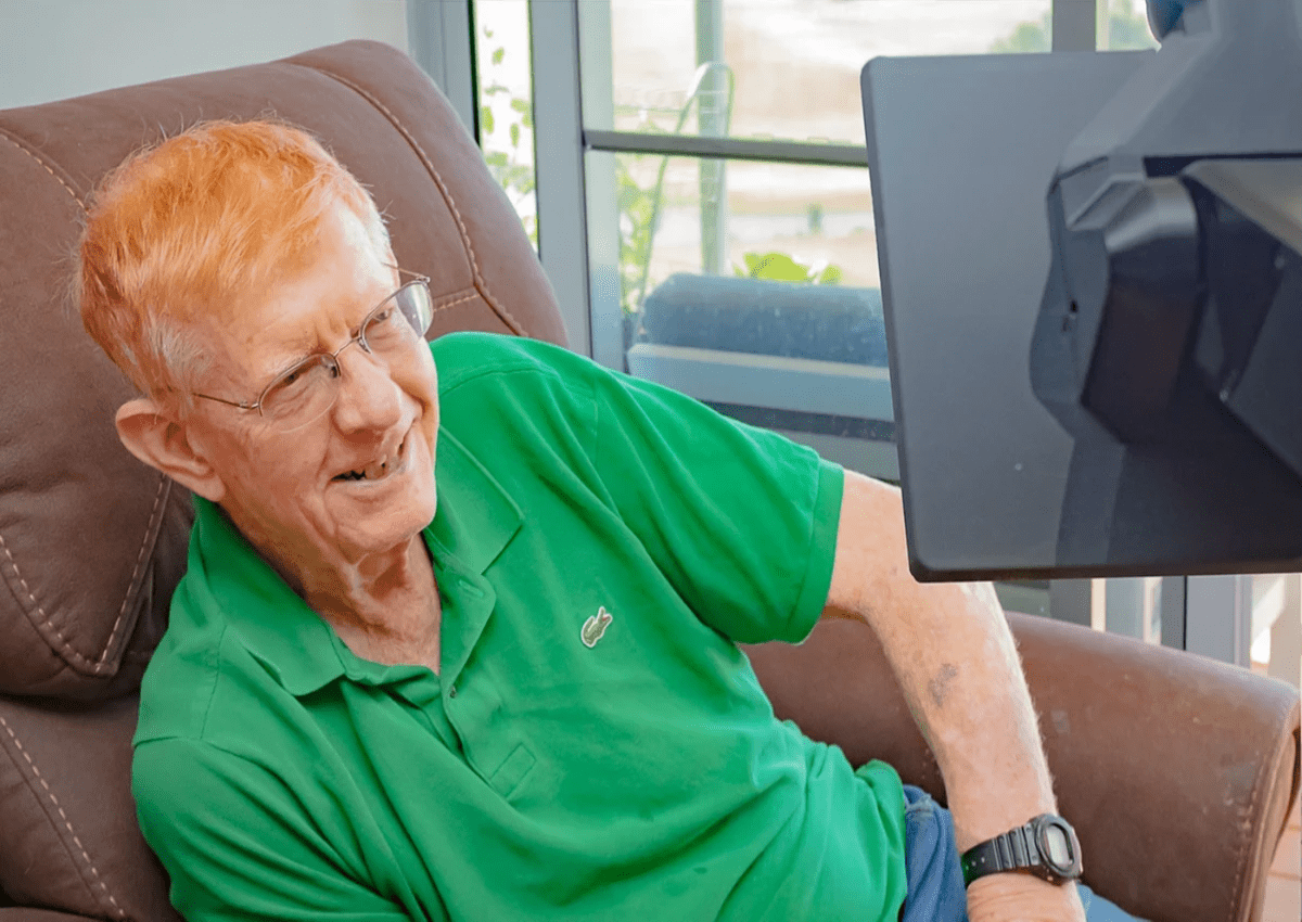 Elderly man is greeted by son through telepresence robot Elderly man is greeted by son through telepresence robot