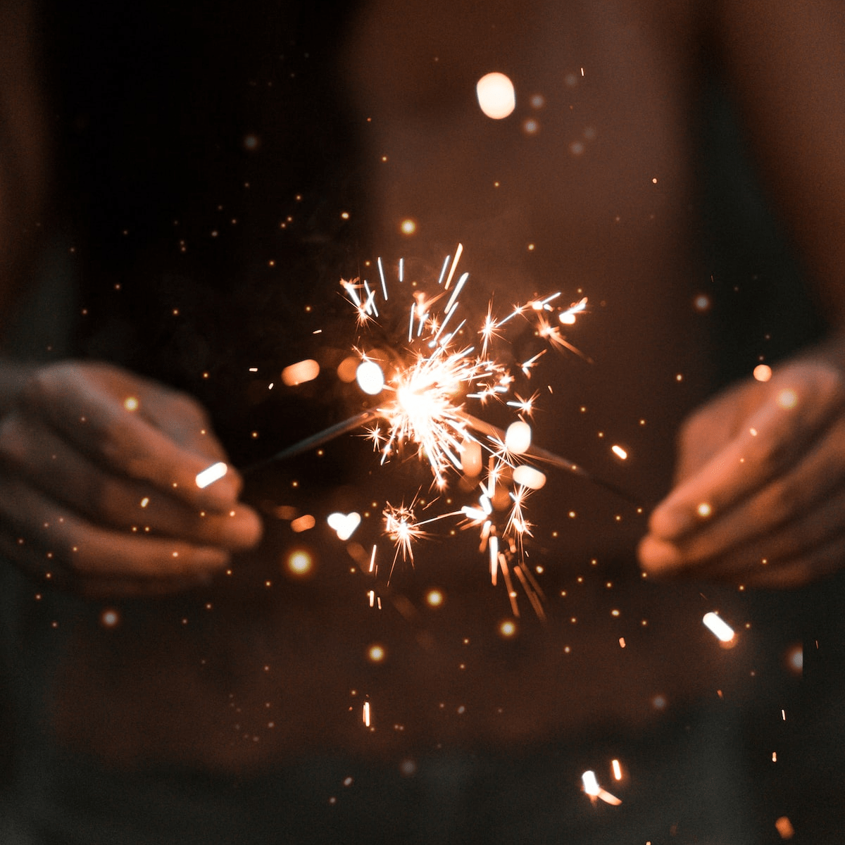 hands with two sparklers hands with two sparklers