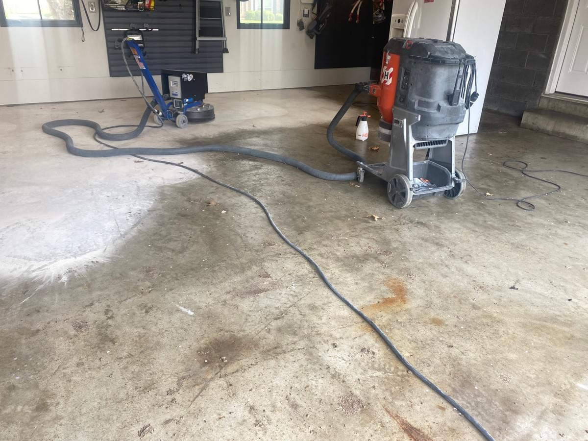Quality Floor Coatings, a garage floor solutions company in Ellisville, MO, showcasing a garage floor makeover. The image shows a gray and black patterned epoxy floor installed by Quality Floor Coatings. The floor is glossy, smooth, and durable, providing a modern and functional look to the garage. Quality Floor Coatings, a garage floor solutions company in Ellisville, MO, showcasing a garage floor makeover. The image shows a gray and black patterned epoxy floor installed by Quality Floor Coatings. The floor is glossy, smooth, and durable, providing a modern and functional look to the garage.