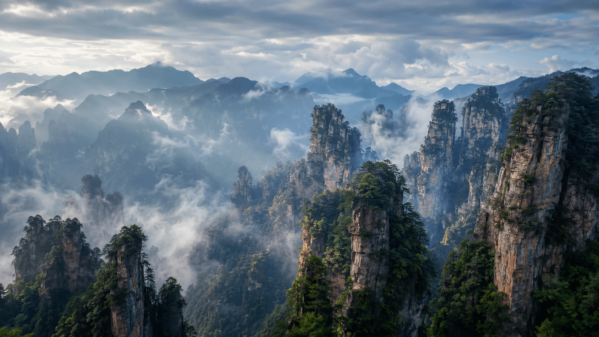 Clouds drifting between sandstone peaks at Tianzi Mountain in Zhangjiajie Clouds drifting between sandstone peaks at Tianzi Mountain in Zhangjiajie