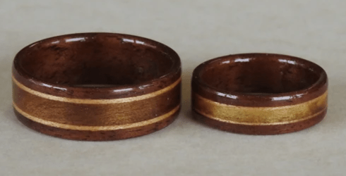 Walnut wood rings with Center inlay of Magnolia bordered by narrow birch. Learn about the spiritual qualities of Magnolia Wood Walnut wood rings with Center inlay of Magnolia bordered by narrow birch. Learn about the spiritual qualities of Magnolia Wood