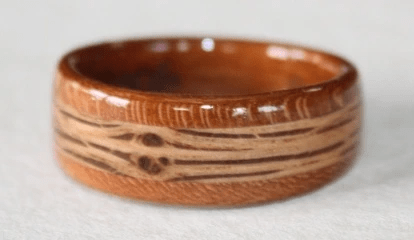 Tapered CHERRY wood ring with an Oak Double Knot inlay Tapered CHERRY wood ring with an Oak Double Knot inlay