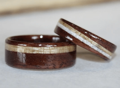 Walnut wood rings with Myrtle inlays. Second spiraled inlay on smaller ring is client's shell. Walnut wood rings with Myrtle inlays. Second spiraled inlay on smaller ring is client's shell.