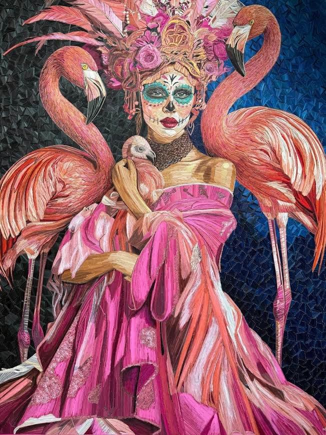 Contemporary popotillo artwork by Ariosto Rivera featuring a Catrina-inspired woman in a flowing pink dress surrounded by flamingos and intricate floral details. Contemporary popotillo artwork by Ariosto Rivera featuring a Catrina-inspired woman in a flowing pink dress surrounded by flamingos and intricate floral details.