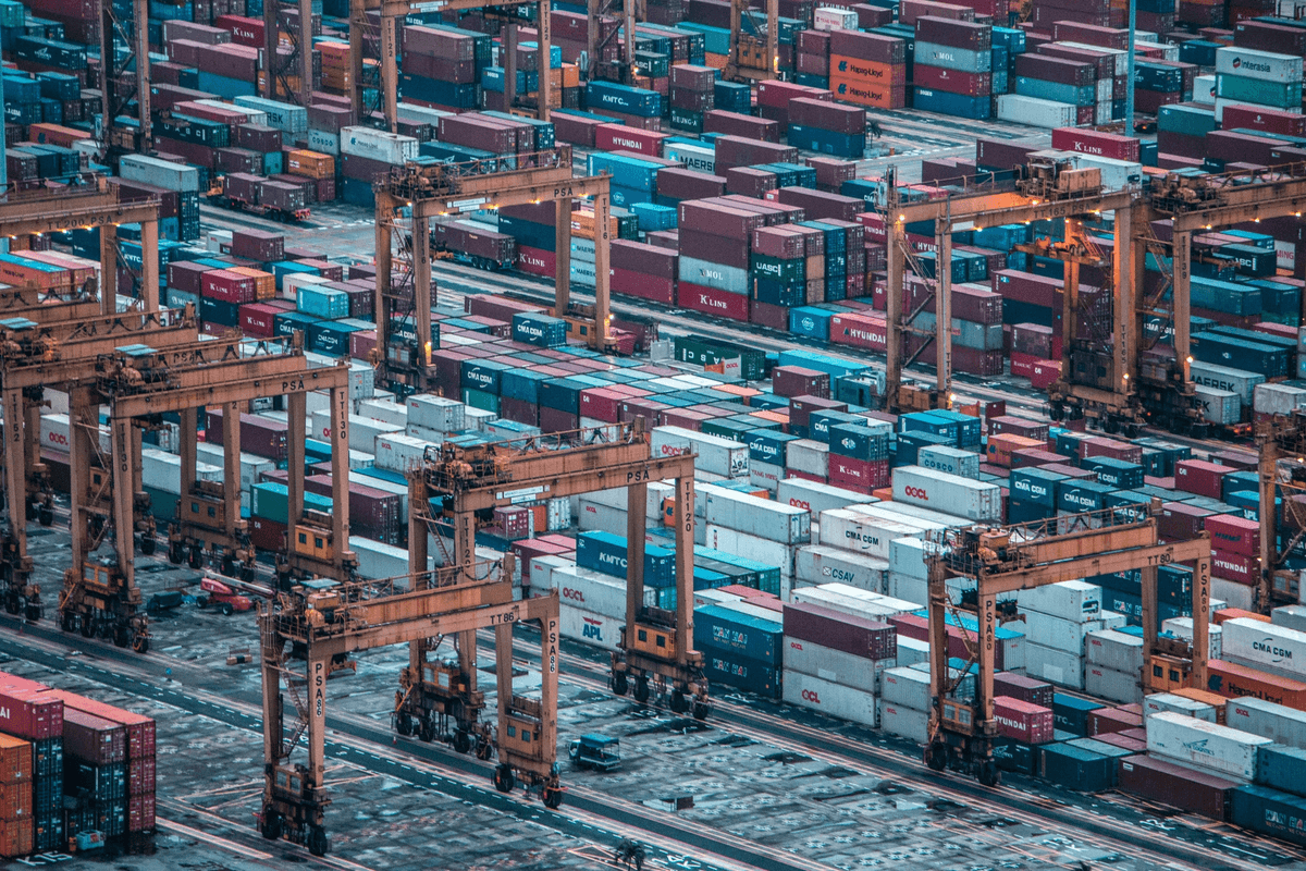 Containers being inspected at a port yard Containers being inspected at a port yard