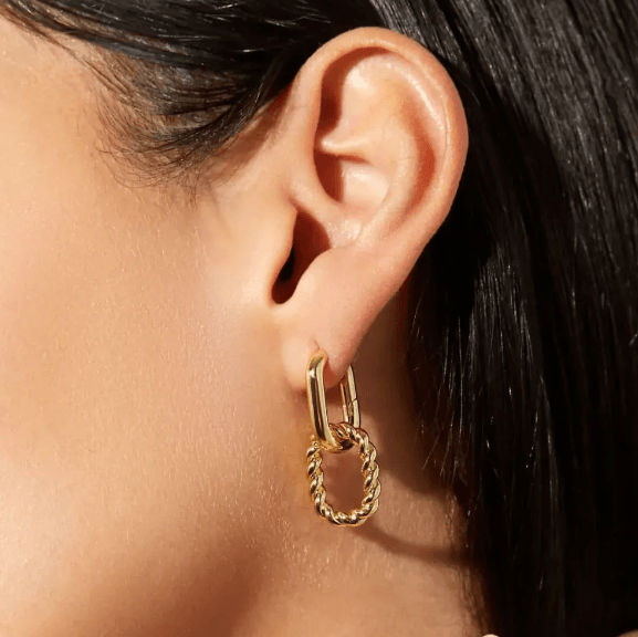 Changeable Earrings Hoops displayed on elegant jewelry stand Changeable Earrings Hoops displayed on elegant jewelry stand