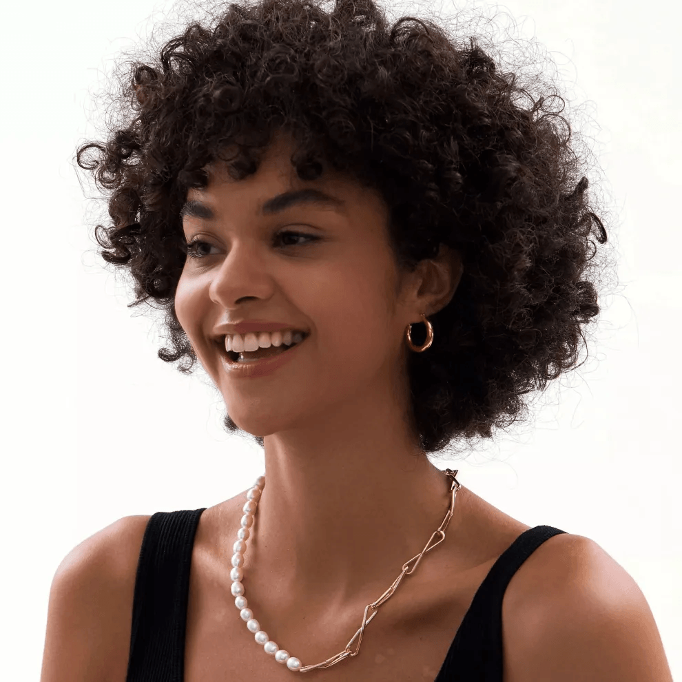 Stylish women showcasing their stunning gold pearl choker necklace Stylish women showcasing their stunning gold pearl choker necklace