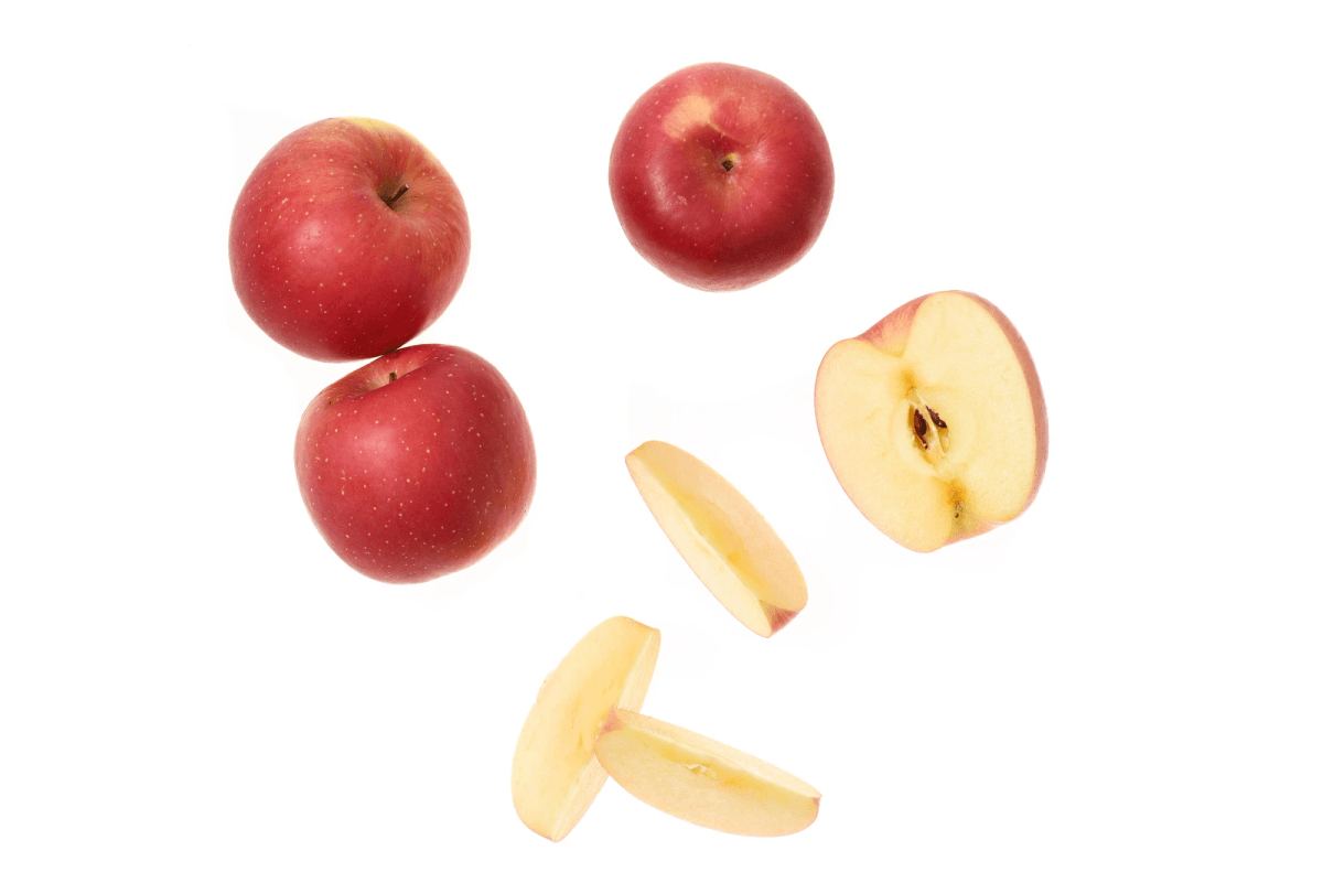 Delicious freeze dried apple slices next to steaming cup. Delicious freeze dried apple slices next to steaming cup.