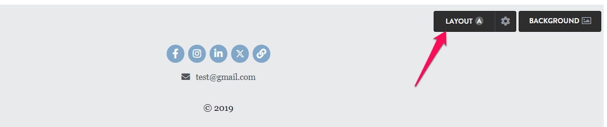 Strikingly footer showing grouped social icons, email contact, copyright text, and layout controls Strikingly footer showing grouped social icons, email contact, copyright text, and layout controls