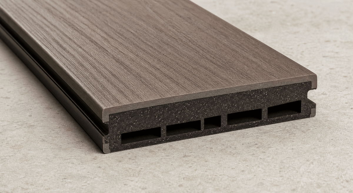 Cutaway view of capped composite decking with core and protective shell Cutaway view of capped composite decking with core and protective shell