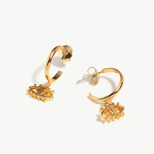 Stylish large drop hoop earrings enhancing facial features. Stylish large drop hoop earrings enhancing facial features.