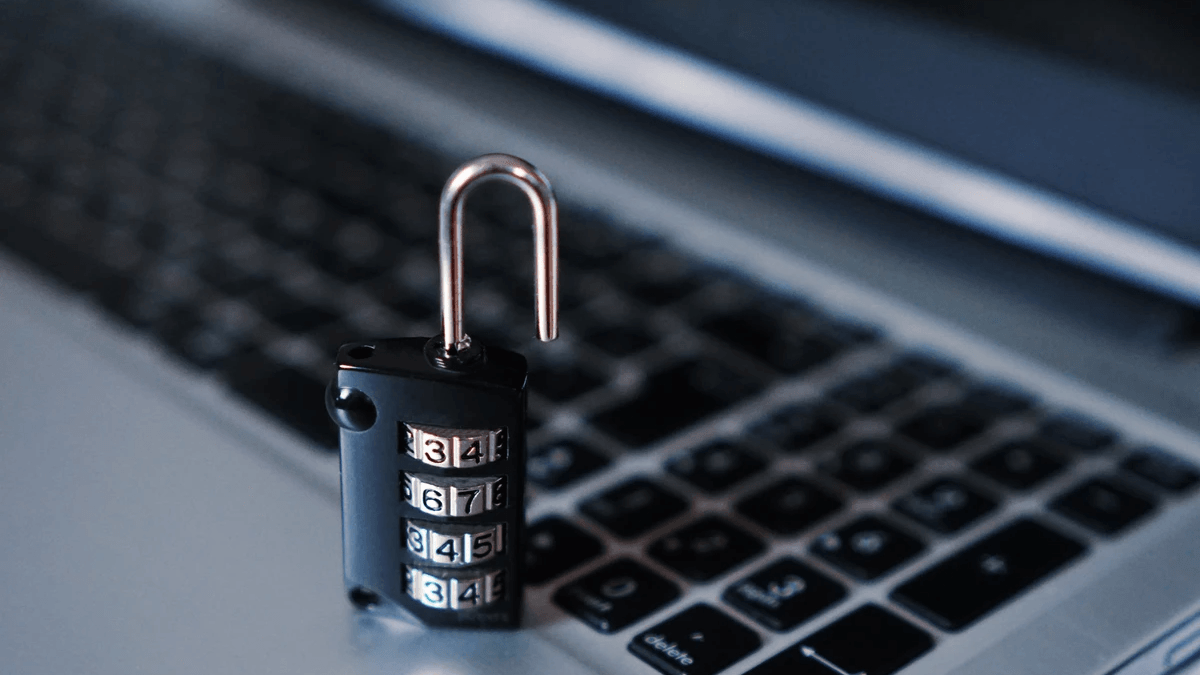 Padlock placed on a laptop keyboard to represent layered website protection Padlock placed on a laptop keyboard to represent layered website protection