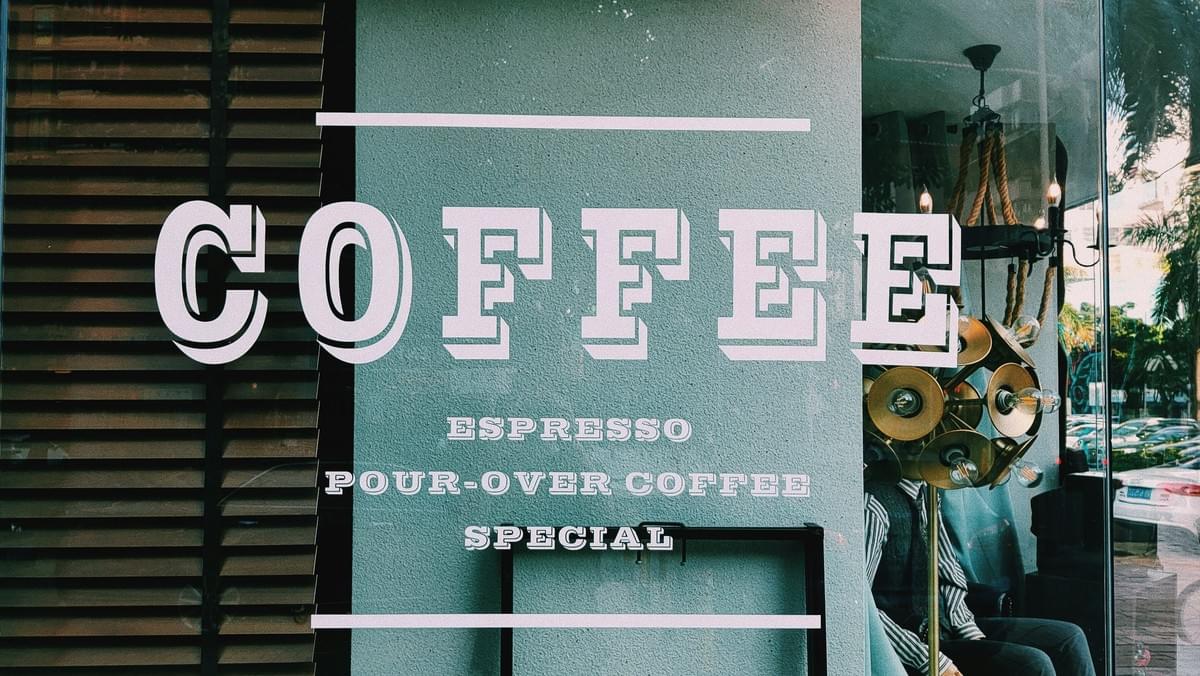 Local coffee shop sign identifying a small business from the street Local coffee shop sign identifying a small business from the street