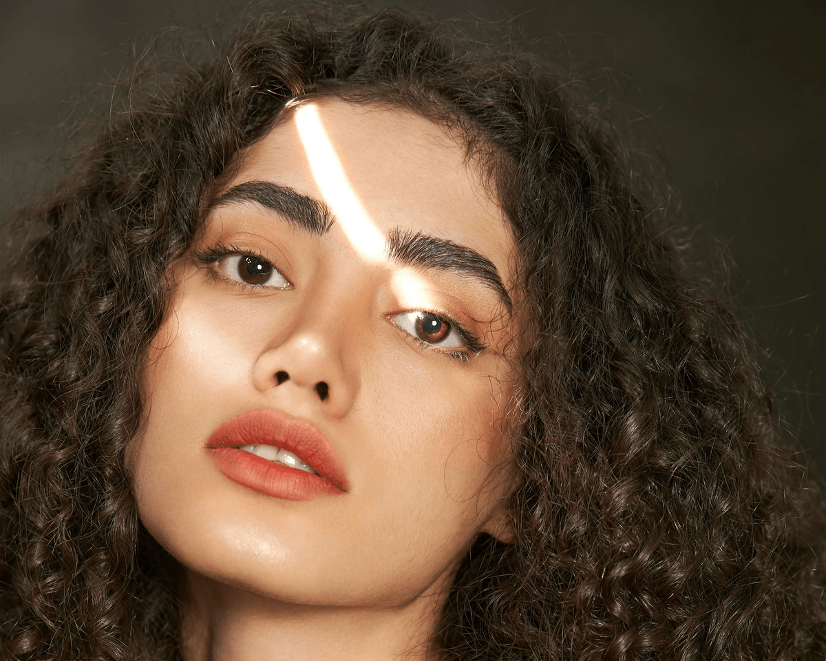 Beautifully blended kinky clip in hair extensions styled into loose curls Beautifully blended kinky clip in hair extensions styled into loose curls
