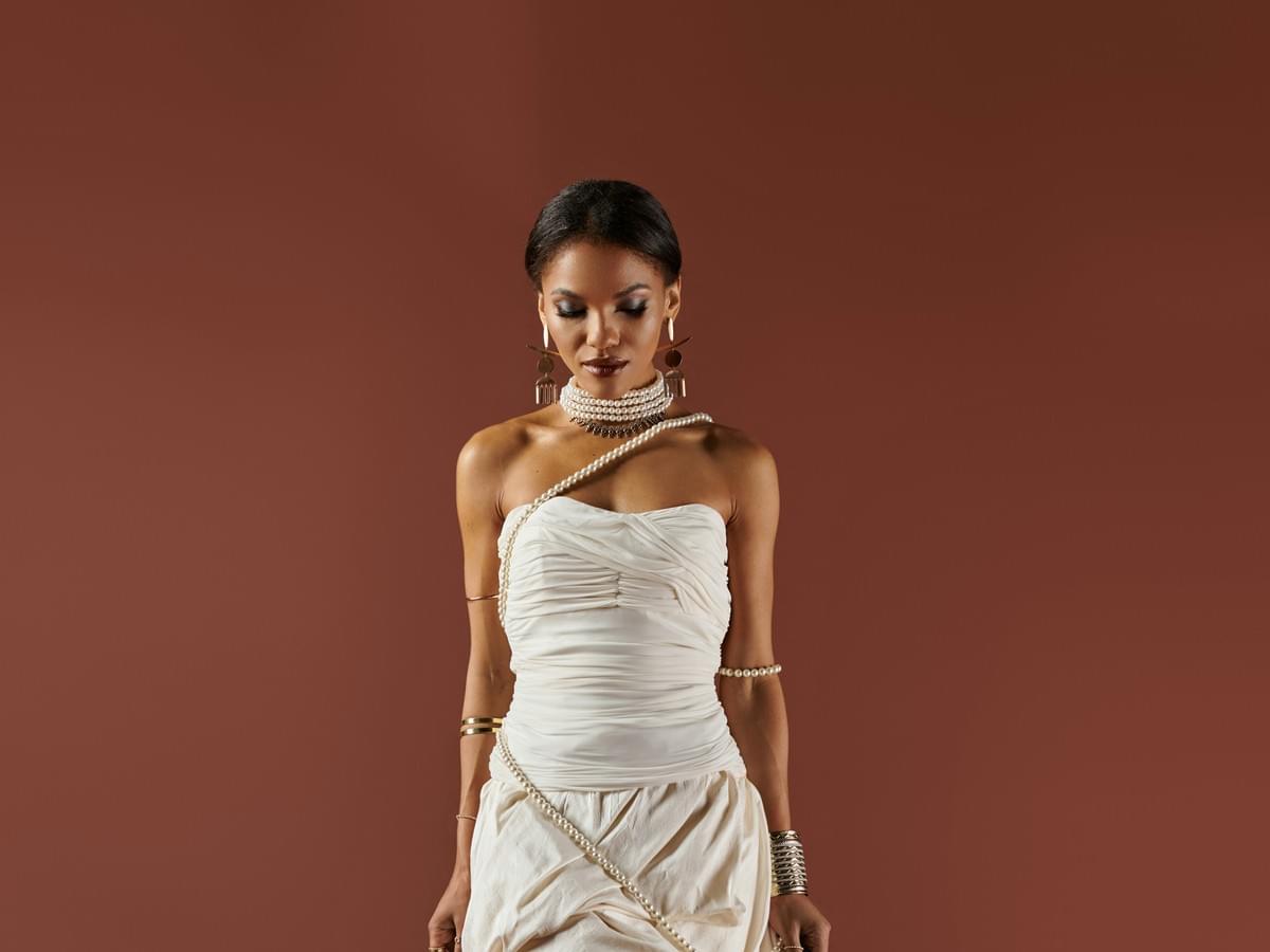Stylish necklace for off the shoulder dress enhances overall look. Stylish necklace for off the shoulder dress enhances overall look.