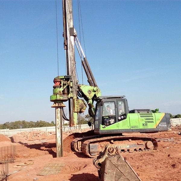 Technician inspecting drill rig component for Why does DTH hammer malfunction Technician inspecting drill rig component for Why does DTH hammer malfunction