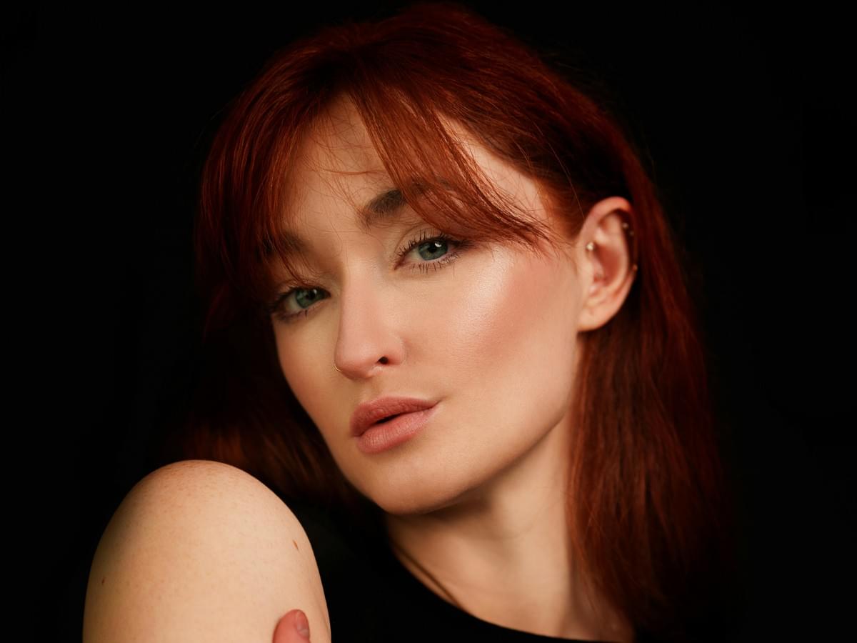 how are human hair wigs made: woman styling a realistic wig how are human hair wigs made: woman styling a realistic wig