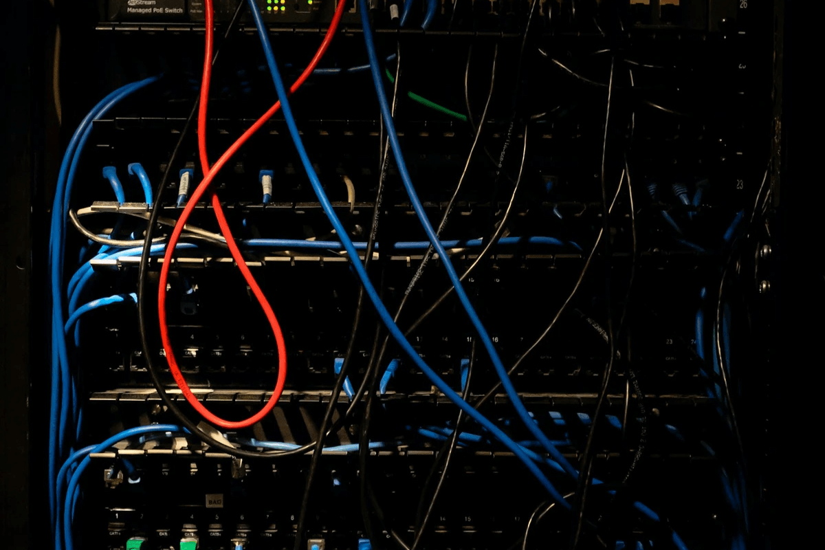 Dark server rack showing redundant DHCP service infrastructure Dark server rack showing redundant DHCP service infrastructure