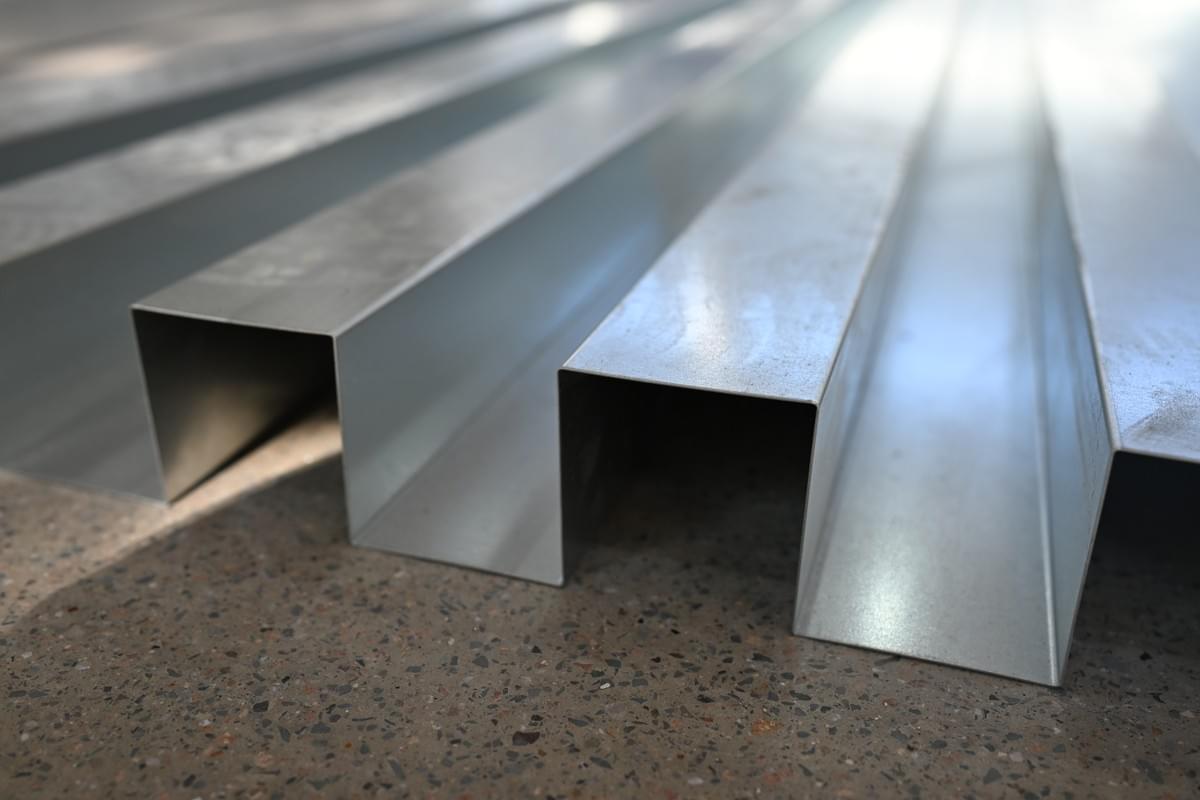 Sheet support system holding long architectural metal blank Sheet support system holding long architectural metal blank