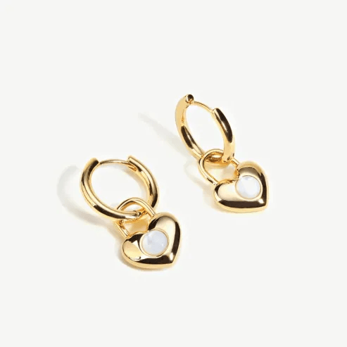 Stylish collection of hoop earrings with interchangeable charms. Stylish collection of hoop earrings with interchangeable charms.