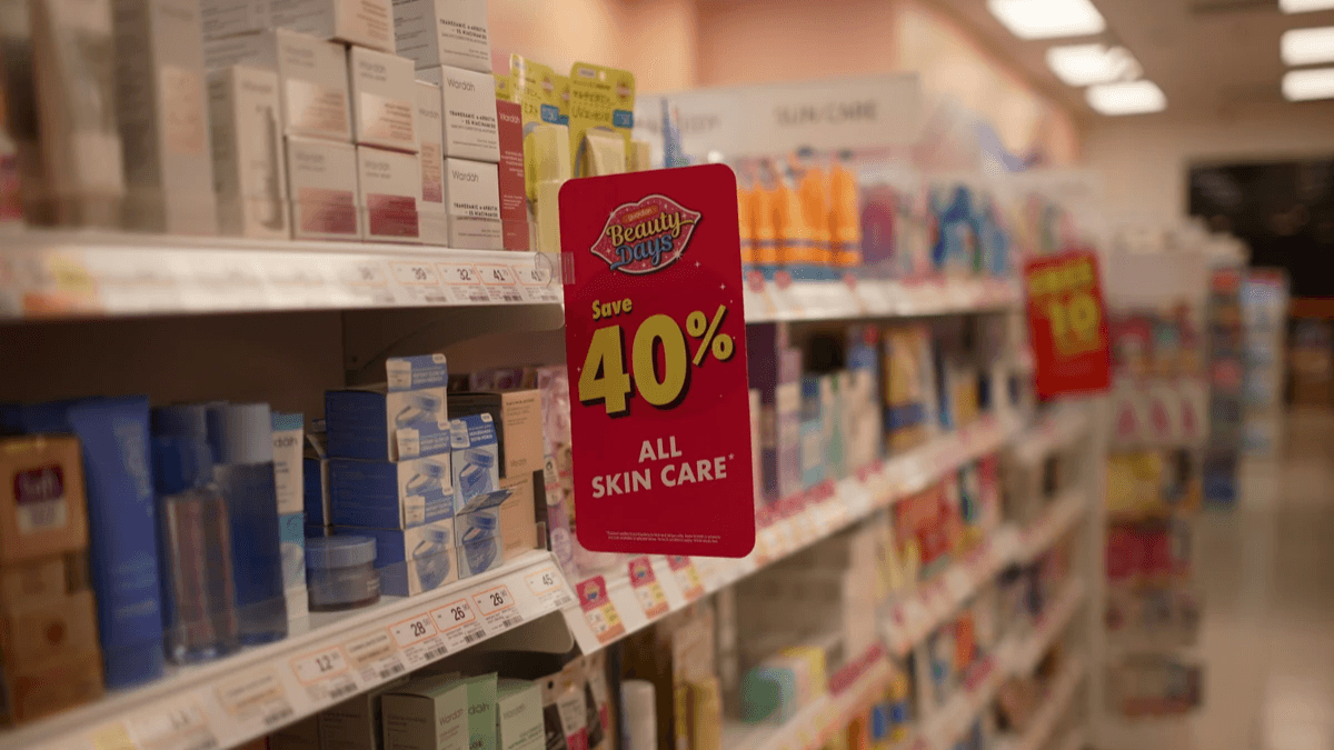 Retail shelves with a clear percentage-off promotion sign Retail shelves with a clear percentage-off promotion sign