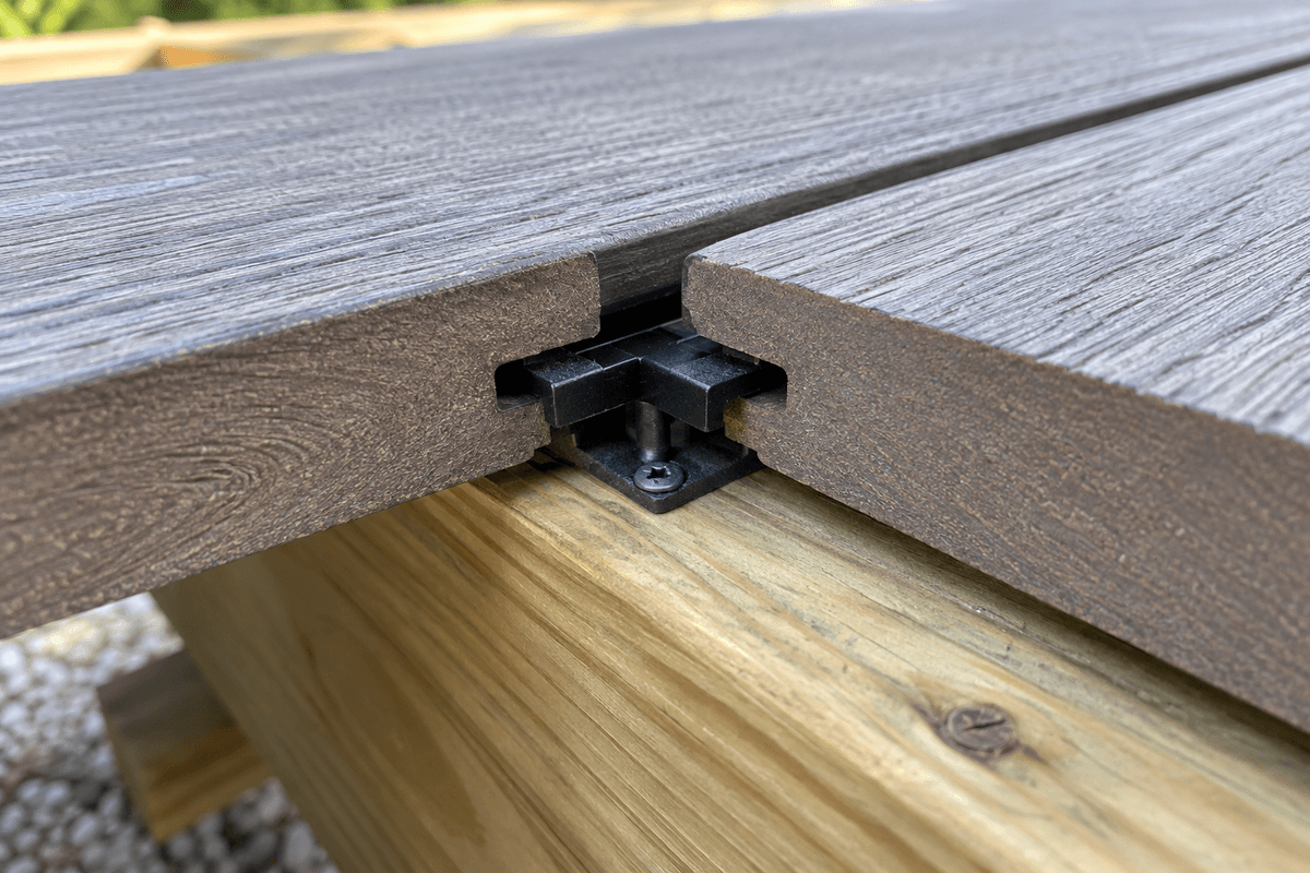 Hidden fastener clip engaged with grooved composite decking Hidden fastener clip engaged with grooved composite decking