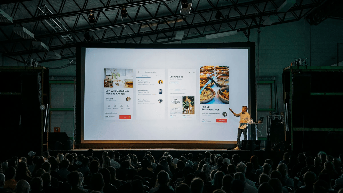 Speaker presenting a clear idea to an attentive business audience Speaker presenting a clear idea to an attentive business audience