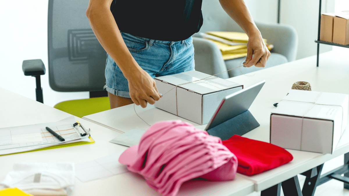 Woman Packing a Merchandise For Selling Woman Packing a Merchandise For Selling