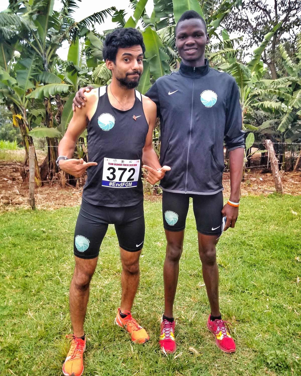 two elite athletes pose for a photo before a race in Kapchorwa, Uganda two elite athletes pose for a photo before a race in Kapchorwa, Uganda