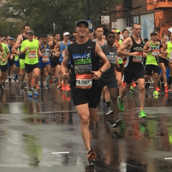 runner at smiling for the camera whilst running in chicago marathon runner at smiling for the camera whilst running in chicago marathon