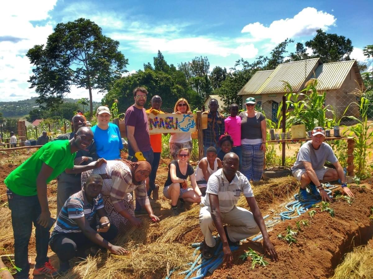 Uganda Marathon participants work with local community projects on a food farm initiative Uganda Marathon participants work with local community projects on a food farm initiative