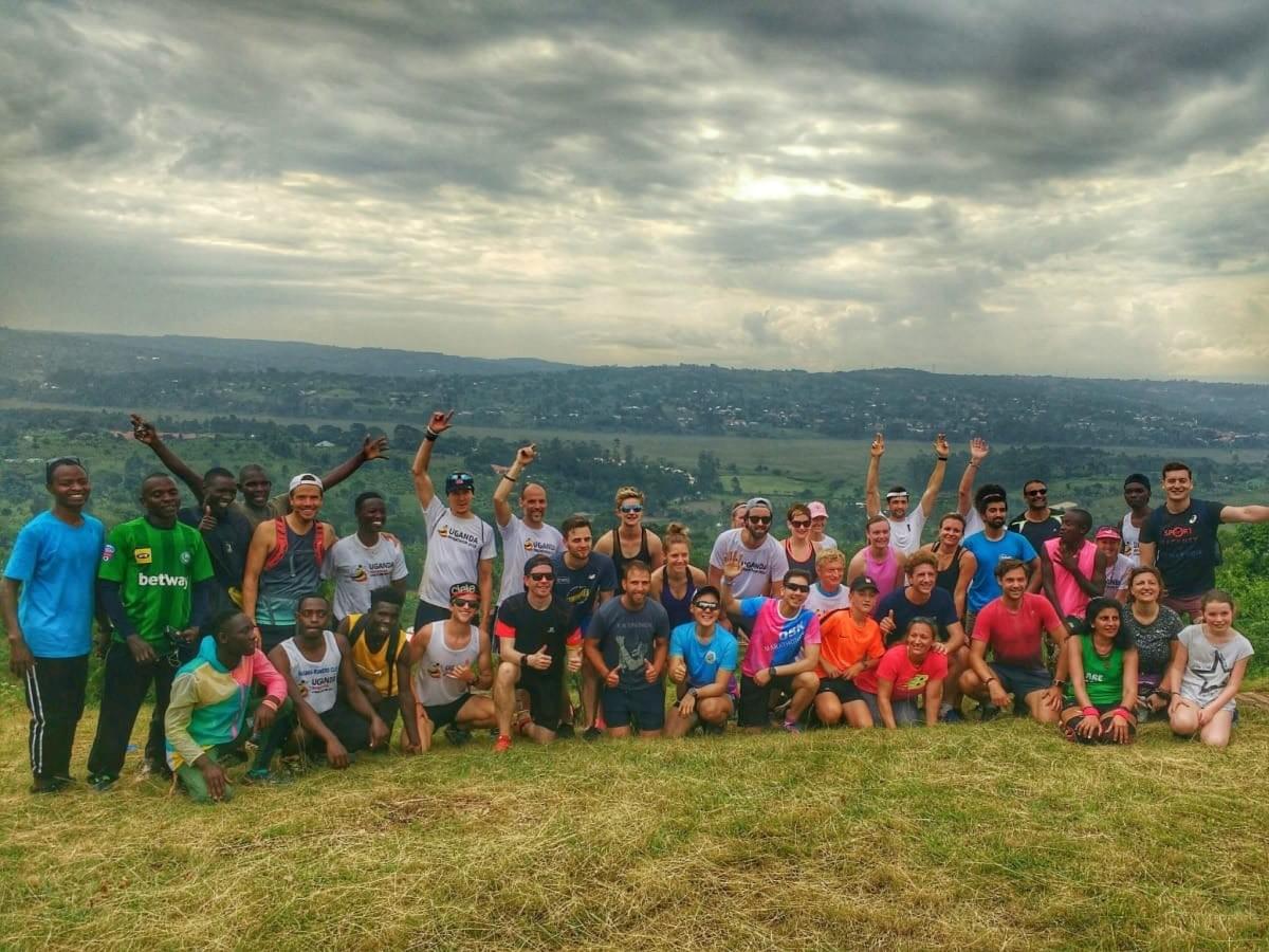 A group photo of Uganda Marathon participants and local runners after their final training run A group photo of Uganda Marathon participants and local runners after their final training run