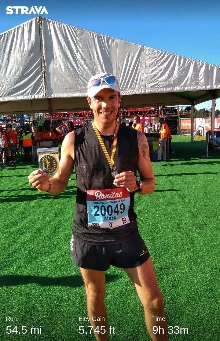 Runner celebrates receiving the Robert Mtshali medal at the finish line of the 2019 Comrades Marathon at Scottsville Racecourse in Pietermaritzburg Runner celebrates receiving the Robert Mtshali medal at the finish line of the 2019 Comrades Marathon at Scottsville Racecourse in Pietermaritzburg