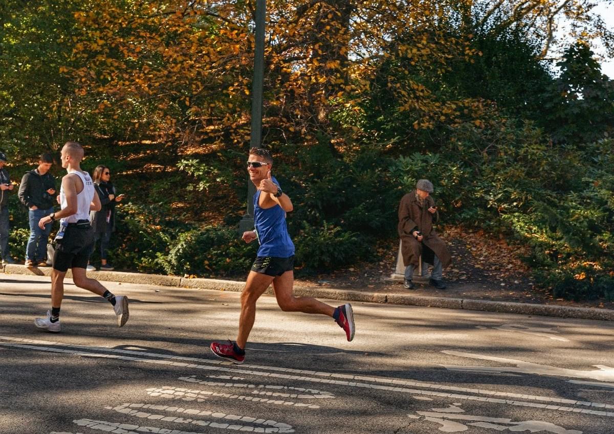 A runner gives a thumbs up whilst passing through Central Park at mile 24 of the New York City marathon A runner gives a thumbs up whilst passing through Central Park at mile 24 of the New York City marathon