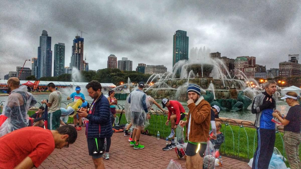 A group of marathon runners prepare for Chicago Marathon 2018 in front of the fountain in Grant Park A group of marathon runners prepare for Chicago Marathon 2018 in front of the fountain in Grant Park