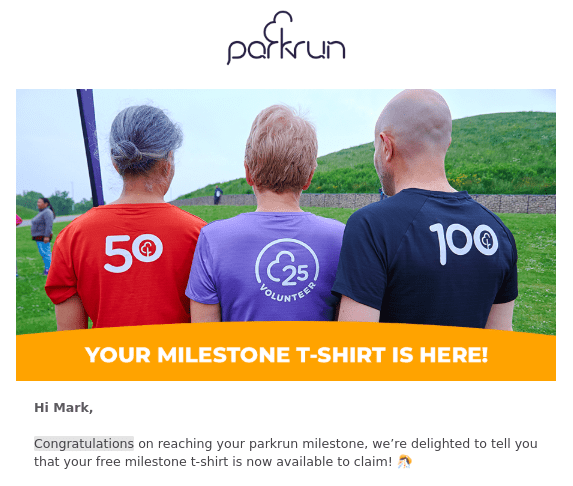 Two runners and a volunteer model the free parkrun 50 t-shirt, 100 t-shirt and 25 t-shirt Two runners and a volunteer model the free parkrun 50 t-shirt, 100 t-shirt and 25 t-shirt