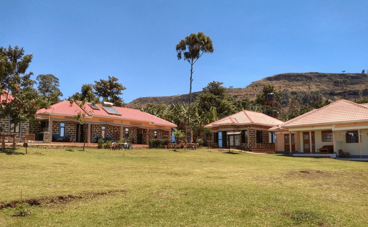 Home of Friends Guesthouse and garden sits against the rocky backdrop of Mount Elgon, Kapchorwa, Uganda Home of Friends Guesthouse and garden sits against the rocky backdrop of Mount Elgon, Kapchorwa, Uganda