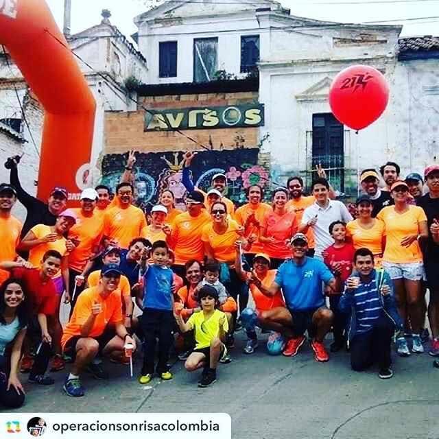 A group of runners from 21Korredores Bogotá pose with children at the Operation Sonrisa 5K race A group of runners from 21Korredores Bogotá pose with children at the Operation Sonrisa 5K race