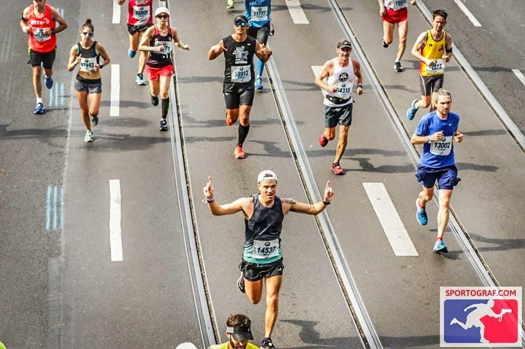 Celebrating running the last few metres on the finishing straight at Berlin Marathon 2018 Celebrating running the last few metres on the finishing straight at Berlin Marathon 2018