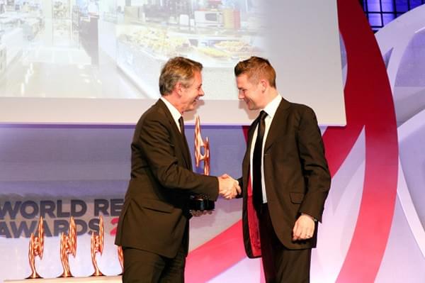 Photo of Austin McGinley collecting a World Retail Award Photo of Austin McGinley collecting a World Retail Award